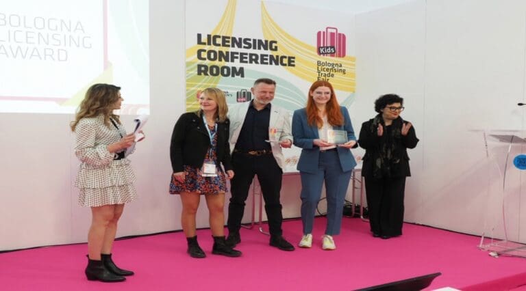 people gather on stage to receive an award