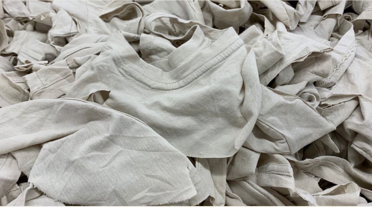 bundle of t shirts in a pile