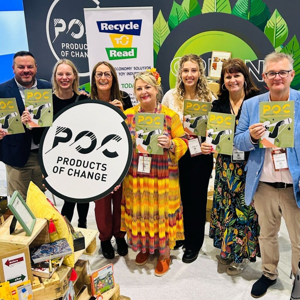 POC team on their booth holidng the new copies of the Future Forecast Report.