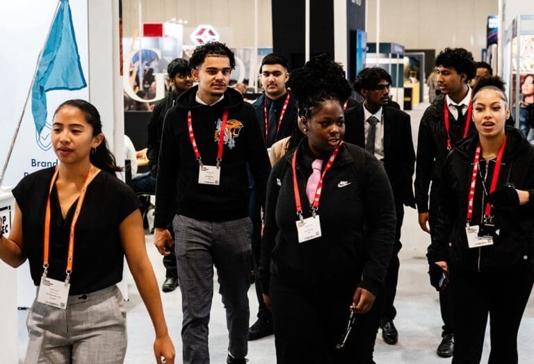 group of young students walk the halls of BLE